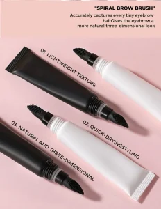 Black and white eyebrow gel tubes with dual spiral brow brushes on pink background