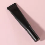 Dual ended brow makeup tube for shaping and setting eyebrow hairs