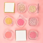 Pressed highlighter and blush shown as two separate face makeup products