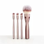 Interchangeable makeup brush heads in a portable magnetic set