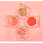Powder highlighter and cheek blush creating a complete complexion makeup look