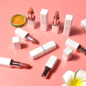 Different lipstick tones displayed in matching cosmetic tubes