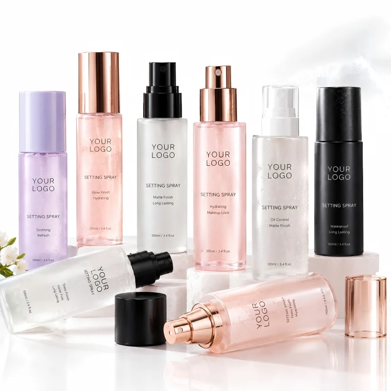 Assorted facial setting mists in frosted glass and pastel bottles designed to keep makeup fresh throughout the day